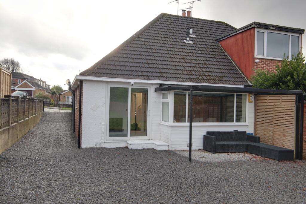 The rear of the property showing the seating area