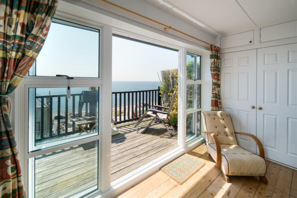 Balcony via Bedroom