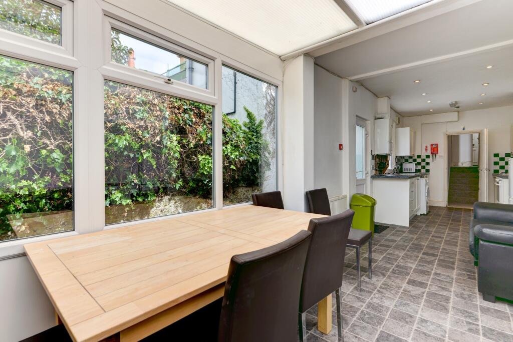 Bright and inviting communal lounge featuring a...