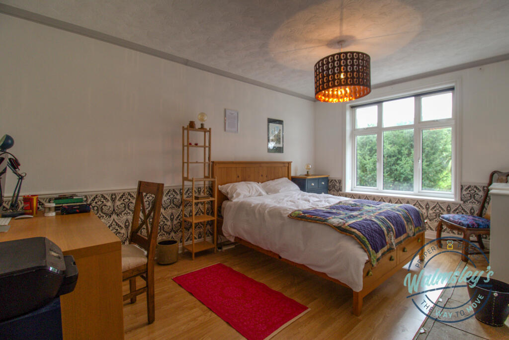 Rear double bedroom with built in wardrobe