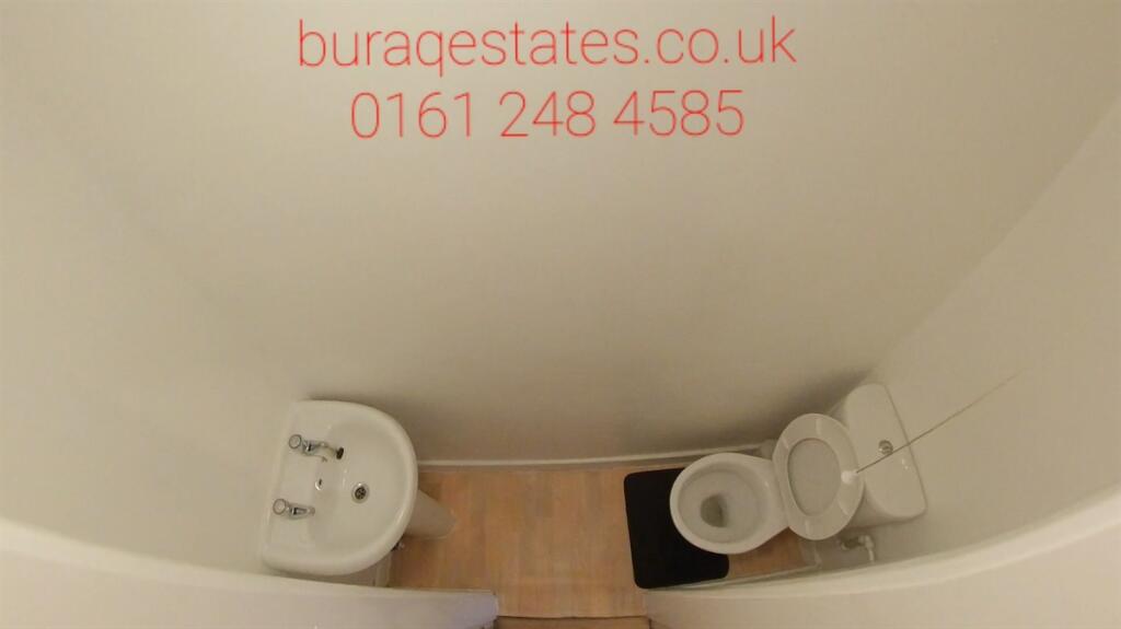 Compact and clean single toilet with white fixt...