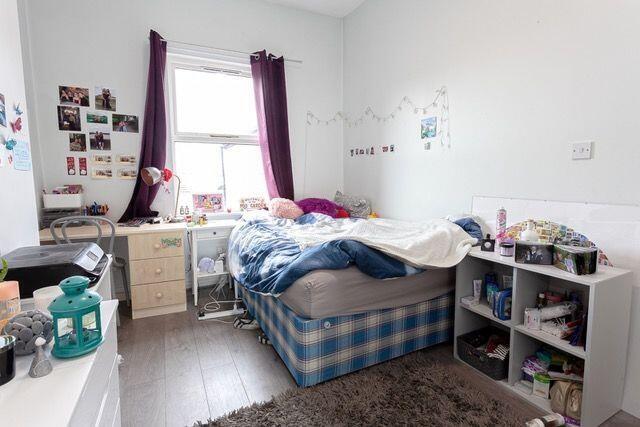 Cozy single bedroom with a comfortable bed, nat...
