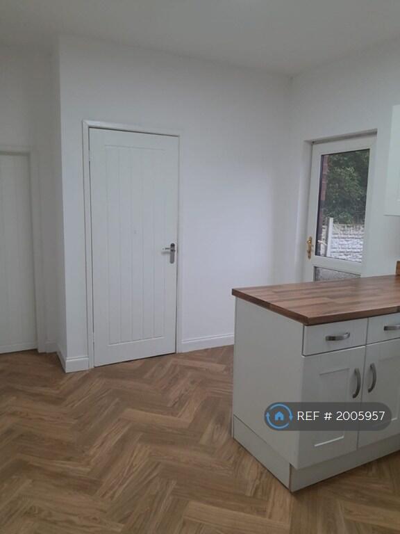 Kitchen Looking At Backdoor And Toilet Downstairs