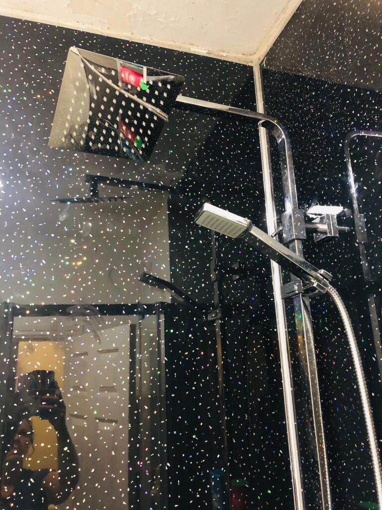 A modern bathroom suite featuring a stylish dua...