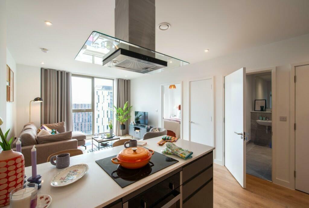 A spacious and well-lit modern living room with...