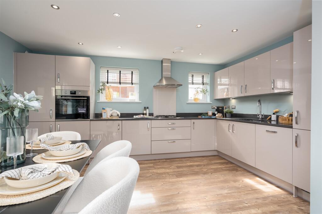 Inside view of the Alderney open plan kitchen. 4 bed home.