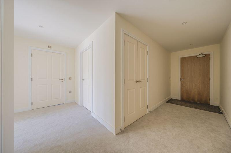 Hallway with storage cupboards