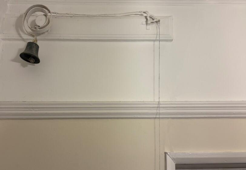 detail of bell pulley system hallway