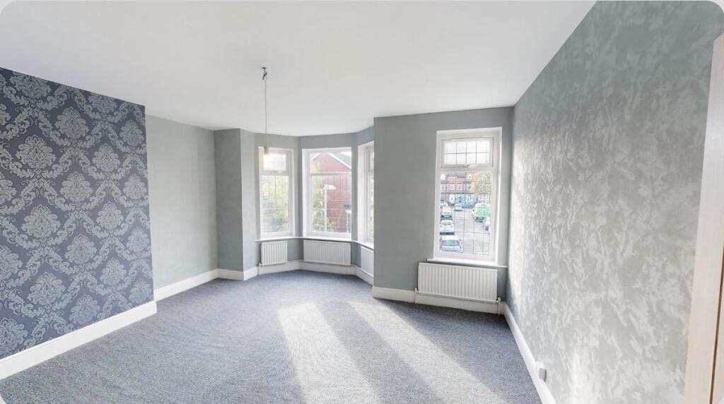 Bright and spacious master bedroom featuring a ...