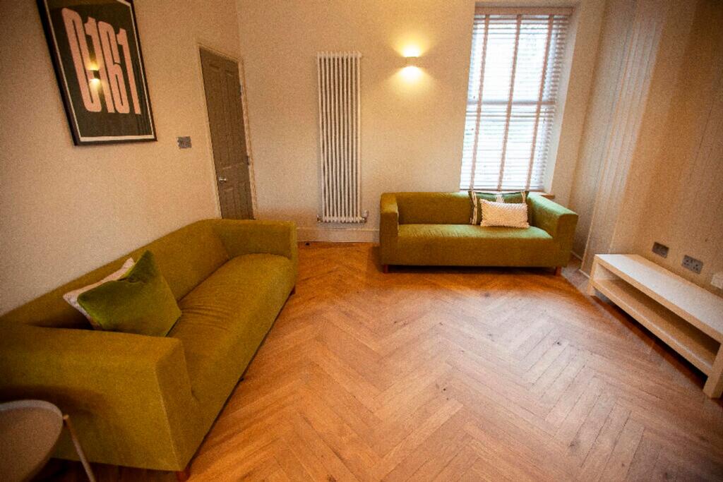 A spacious and inviting modern living room with...