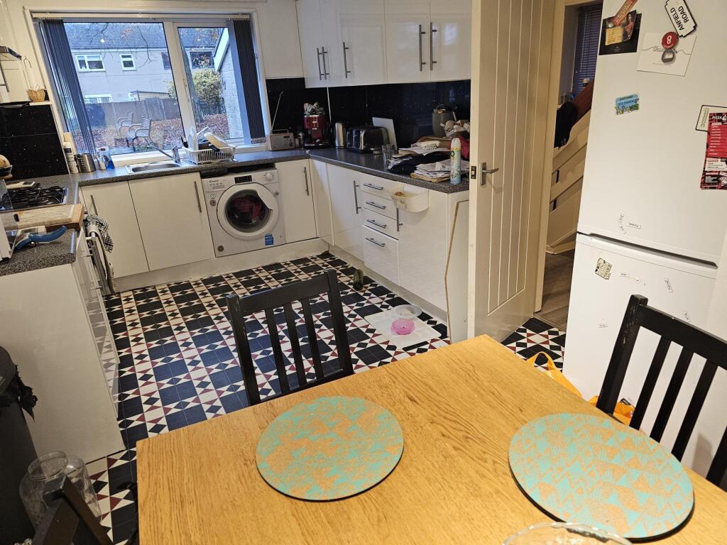 A modern kitchen with ample countertop space, w...