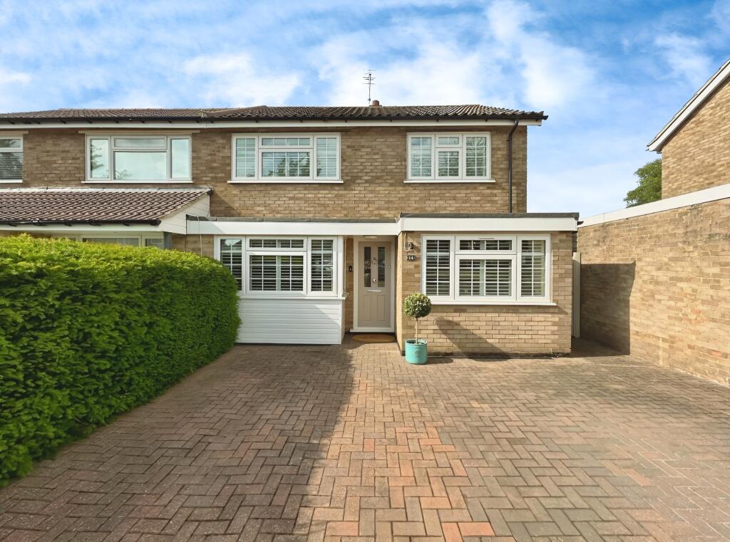 Front View Of The Property With Driveway Parking