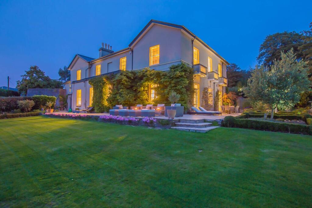 Manor house at dusk from the gardens