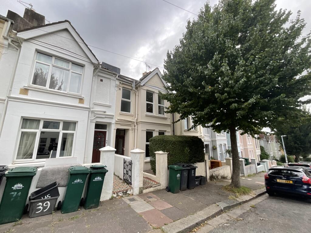A charming row of terraced houses on a quiet st...