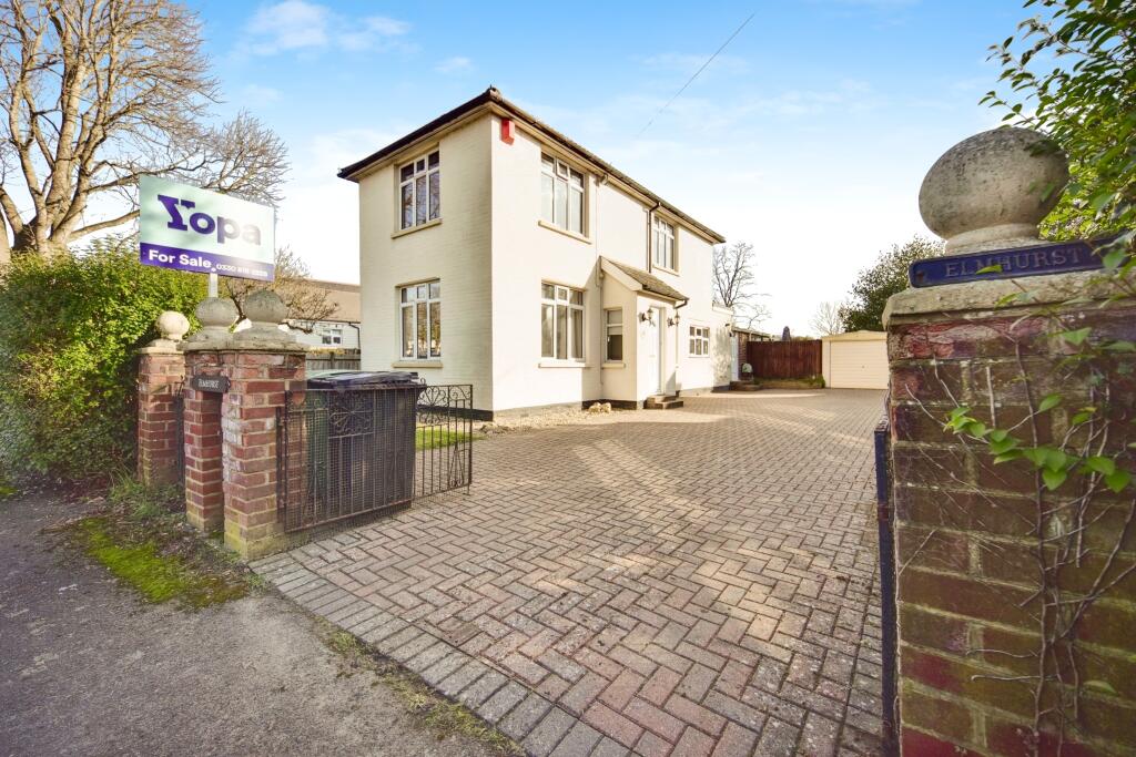 Outside View Of The Property With Driveway Parking
