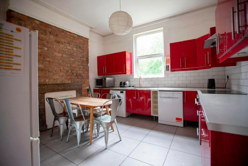 A bright and modern kitchen featuring vibrant r...
