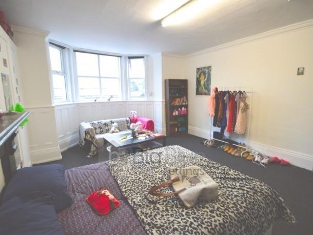 Bright and spacious master bedroom featuring a ...