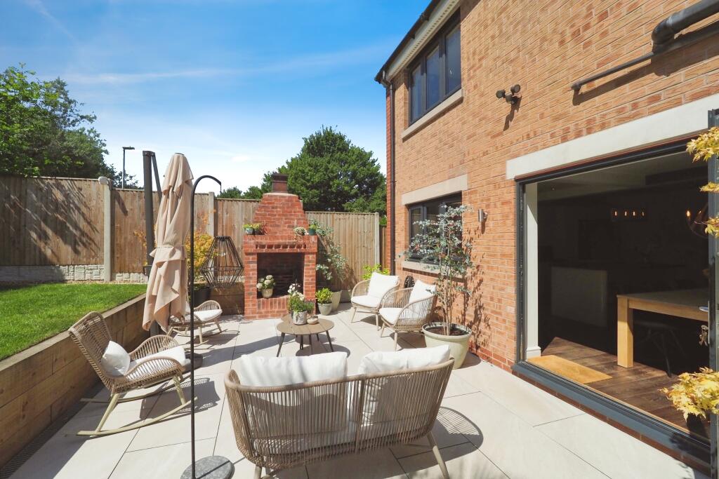 Garden with Feature Fire, multiple seating areas and wow