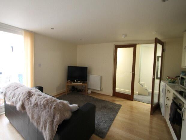 Bright and inviting living room featuring a com...