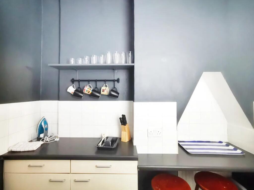 A neat and functional kitchen area featuring da...