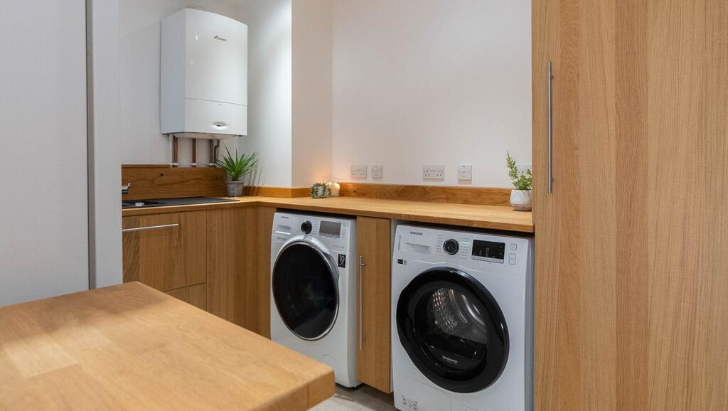 large utility with plumbing for washer and dryer