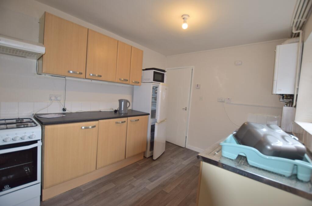 A functional and tidy kitchenette equipped with...