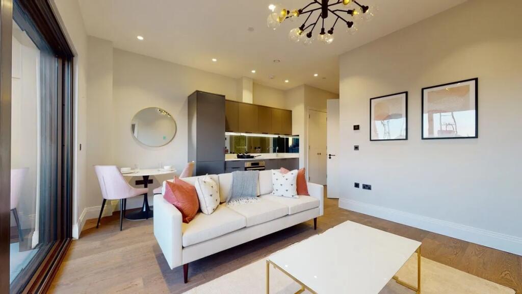 A stylish, contemporary living room featuring a...