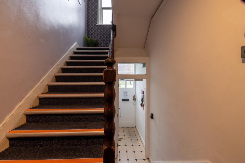 A well-maintained staircase leading to the uppe...