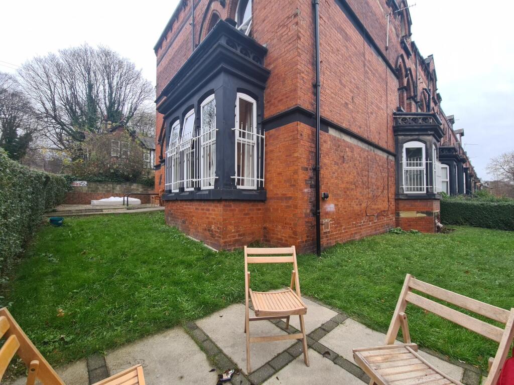 A charming and well-maintained garden area besi...