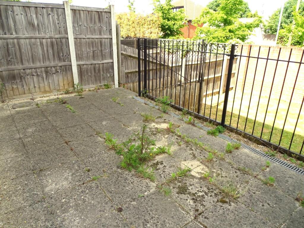 RAISED PAVED PATIO AREA