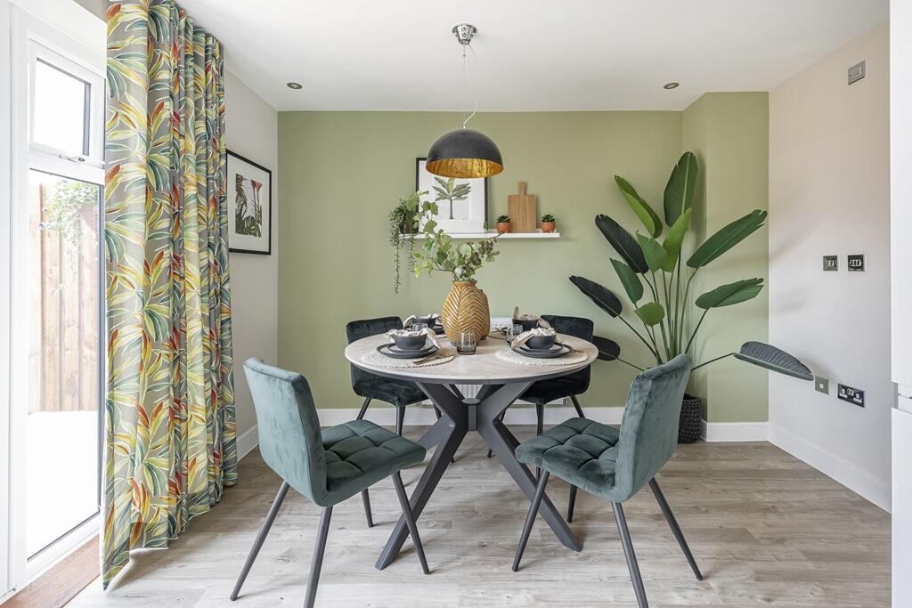 French doors fill the dining area with light, that travels through the home