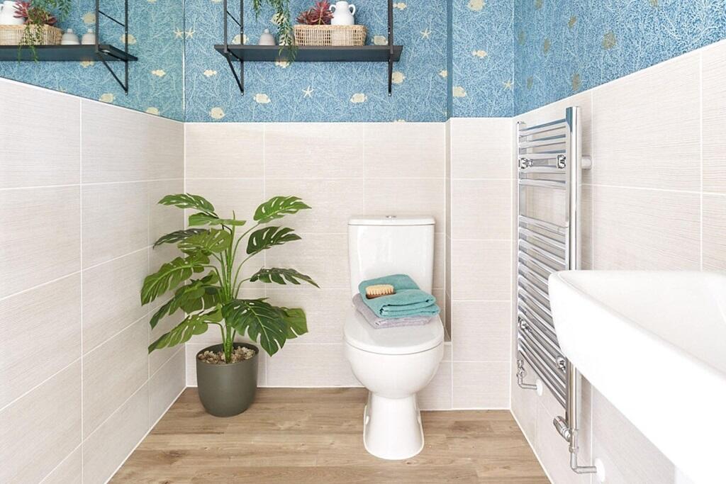 A handy guest cloakroom completes the ground floor