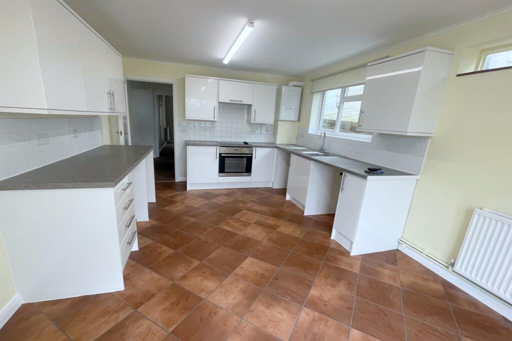 Kitchen leads out to