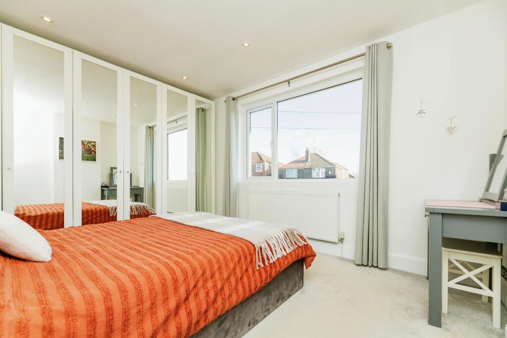 FRONT BEDROOM ONE