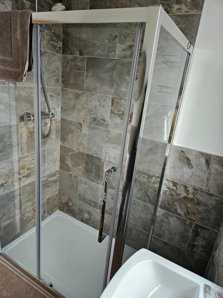 A modern and clean bathroom featuring a stylish...
