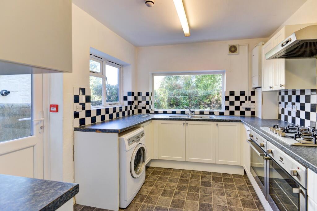 Bright and clean kitchen featuring ample natura...