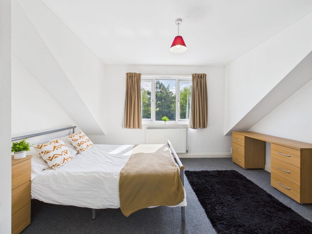 Bright and inviting double bedroom featuring a ...