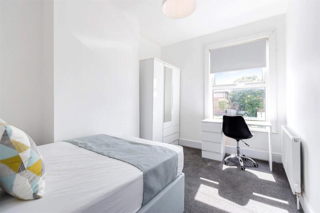 Bright and inviting double bedroom featuring a ...