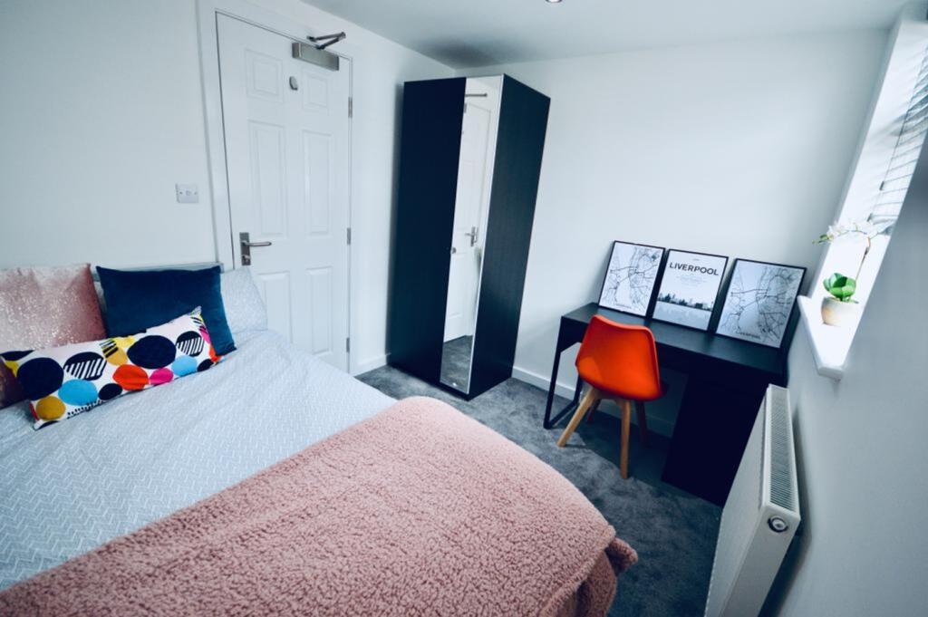 A stylish and inviting double bedroom featuring...