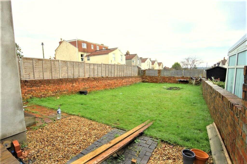 Spacious garden area with well-maintained grass...