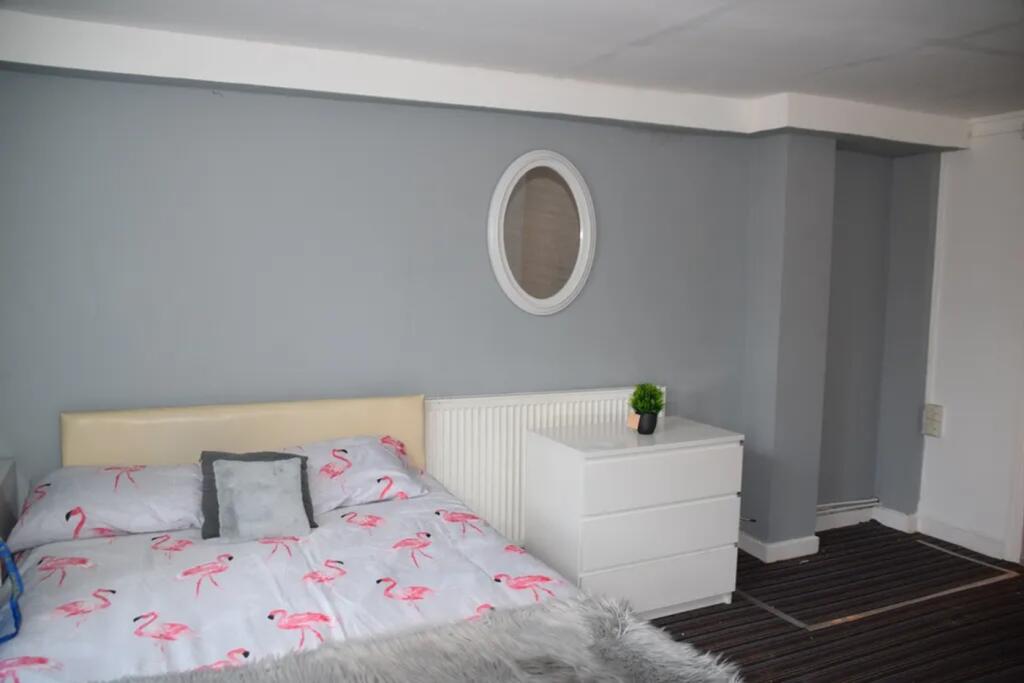 A stylish and inviting double bedroom featuring...