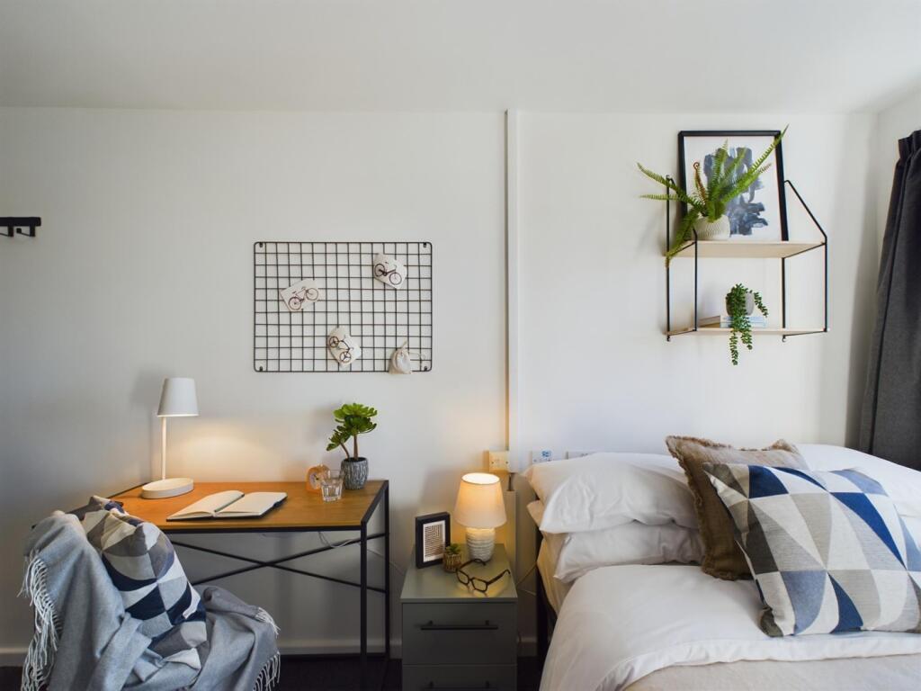A bright and inviting double bedroom, perfect f...