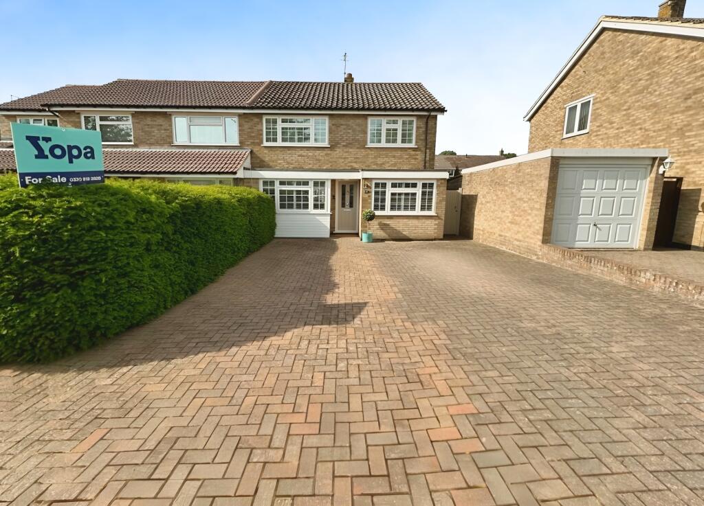 Front View Of The Property With Driveway Parking