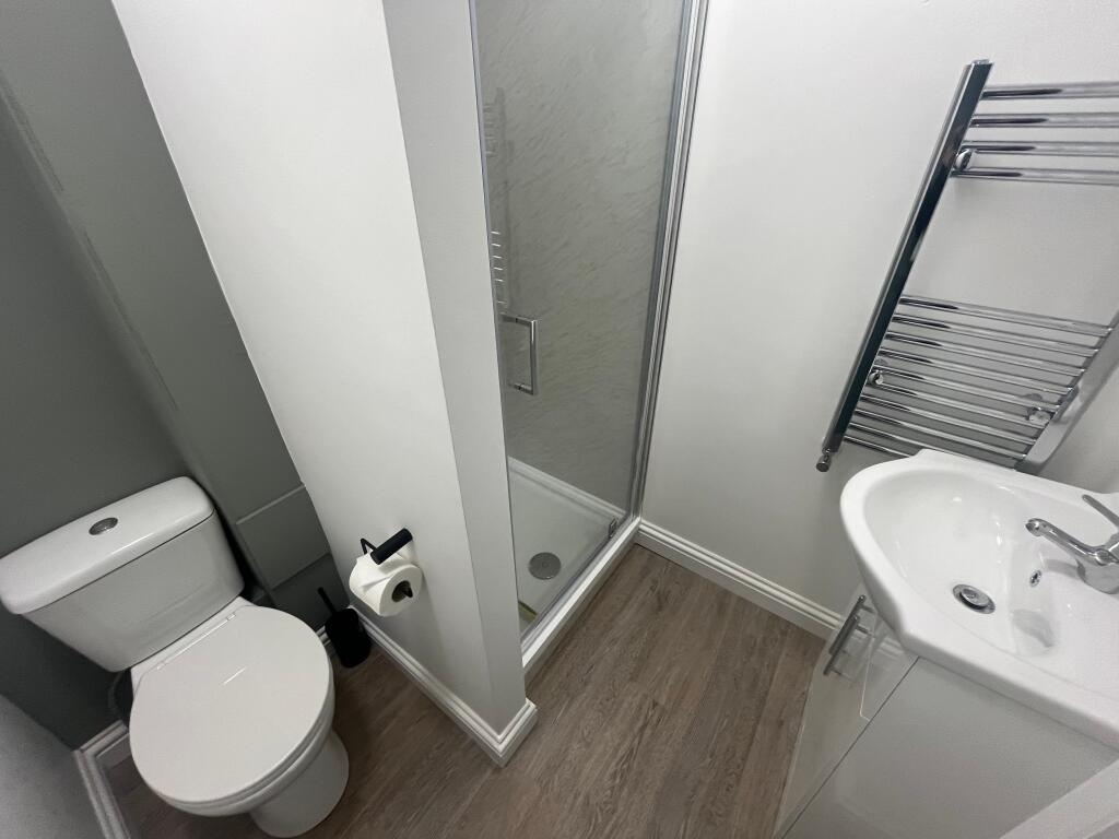 This modern bathroom features a sleek design wi...