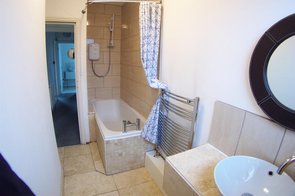 A clean and well-maintained bathroom featuring ...