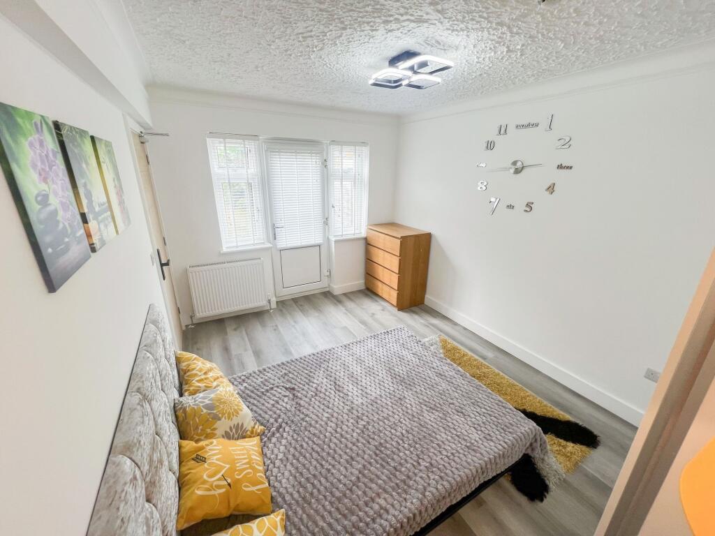 Bright and inviting double bedroom featuring a ...