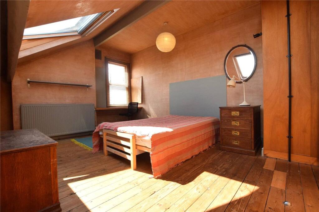 A warm and inviting master bedroom featuring na...