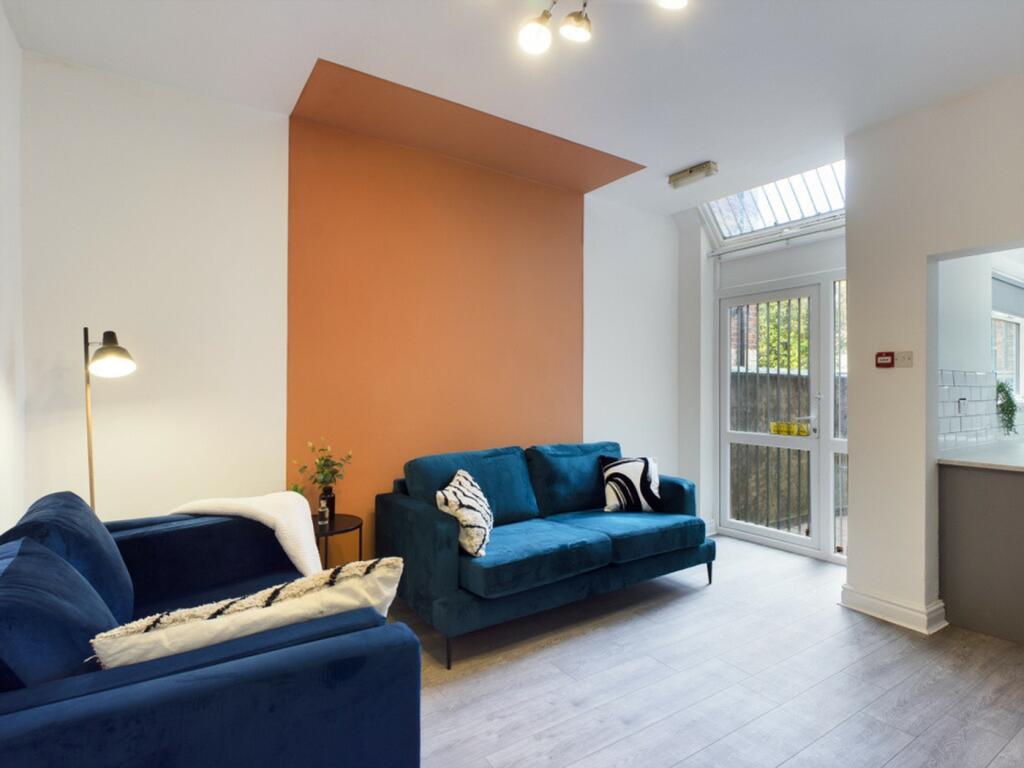 A spacious and stylish modern living room fille...