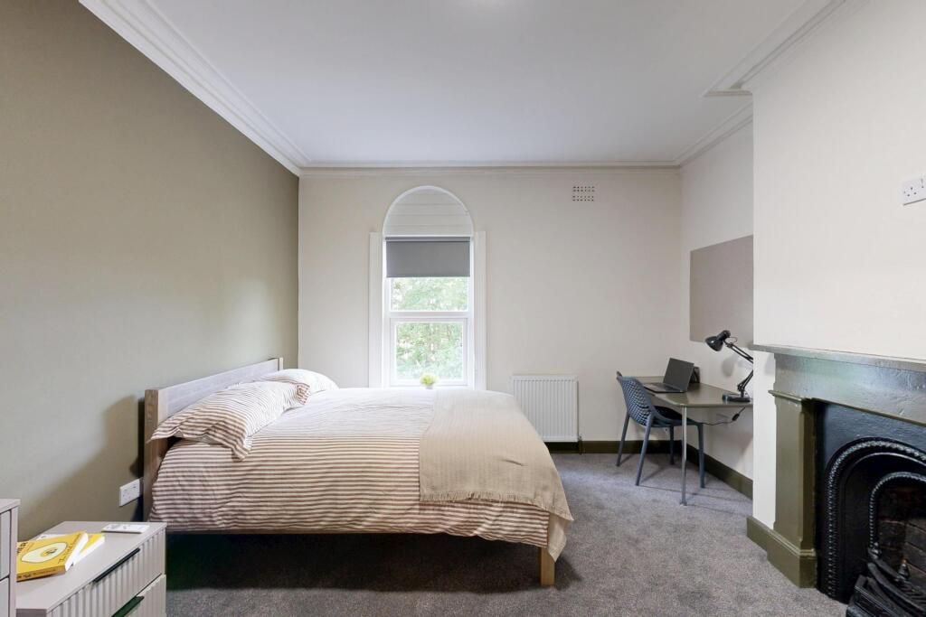 Bright and spacious master bedroom featuring a ...