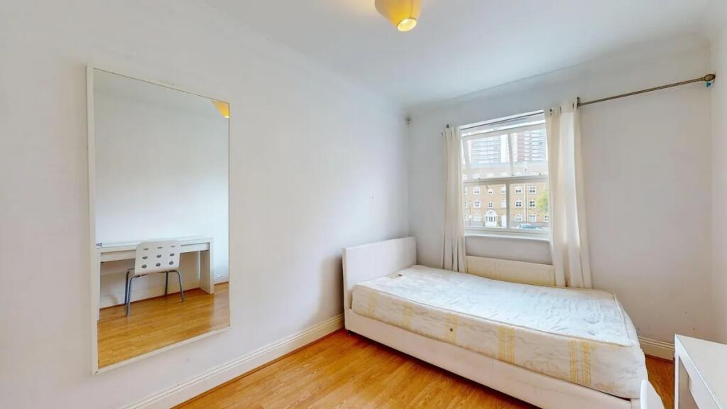 Bright and tidy single bedroom featuring a larg...